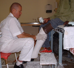 Plaster technician applying PTB plaster